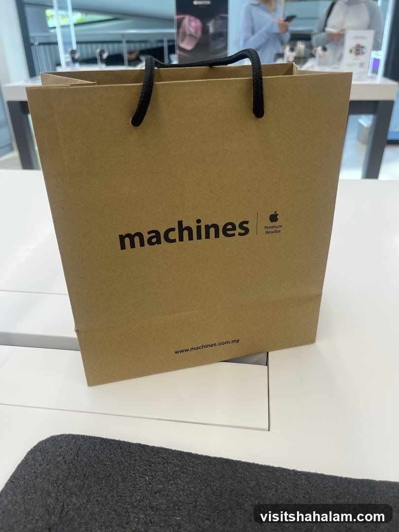 Brown paper shopping bag with "machines" logo