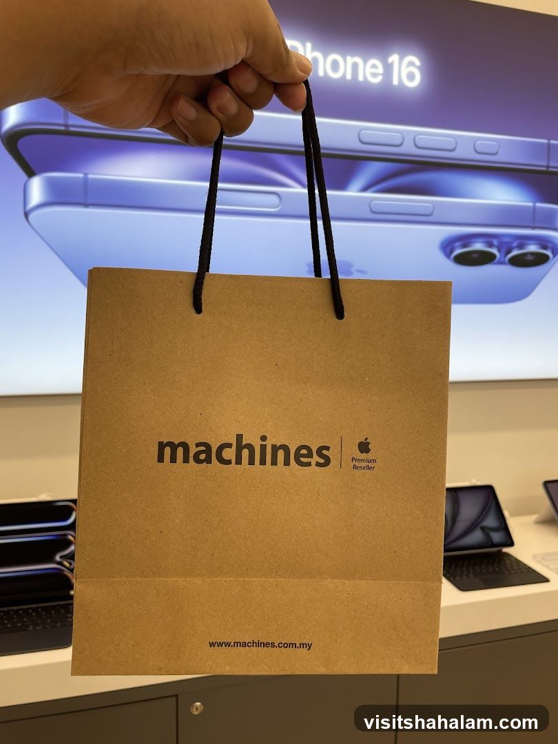 Brown paper shopping bag with "machines" logo