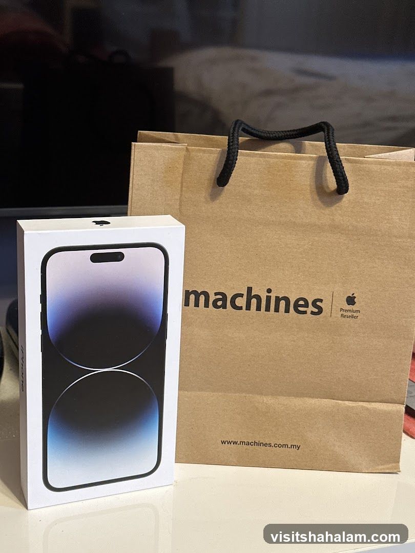 iPhone 14 Pro box and shopping bag