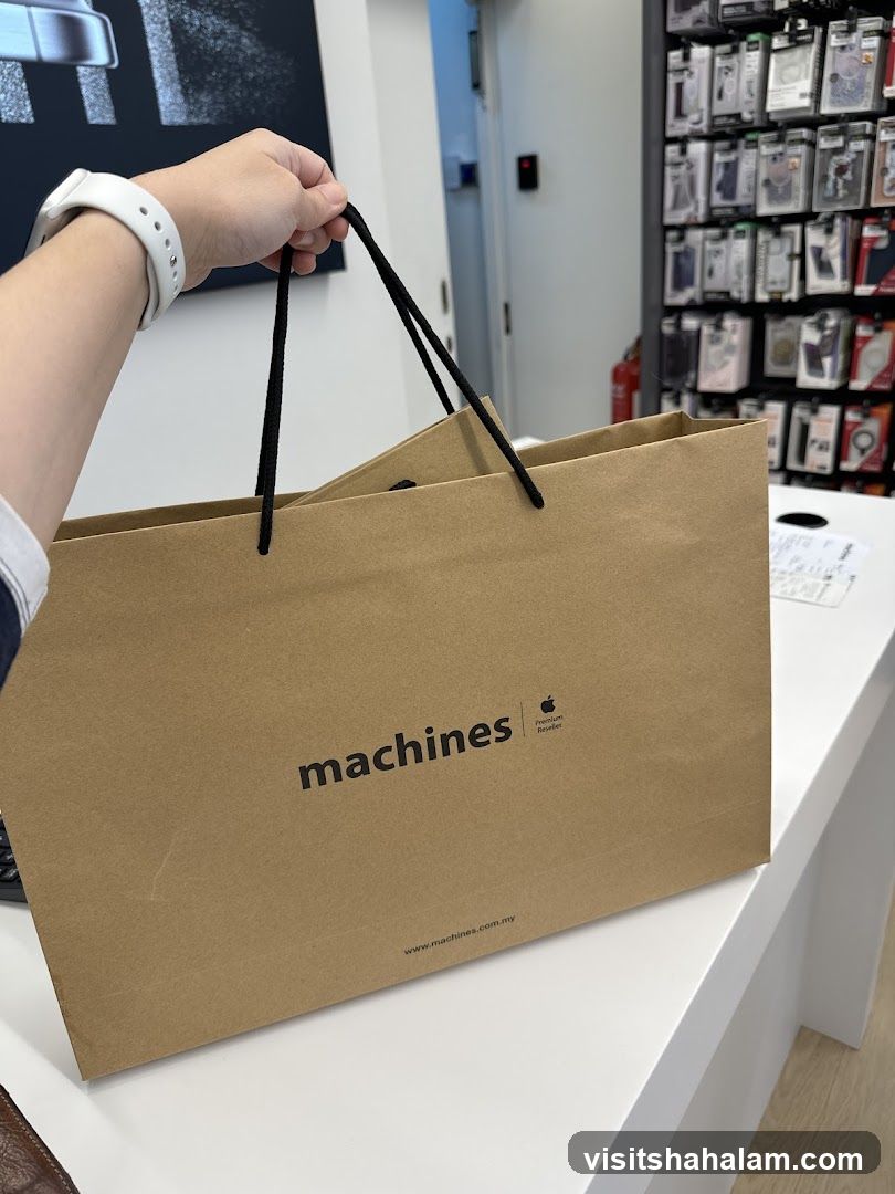 Brown paper shopping bag with "machines" logo