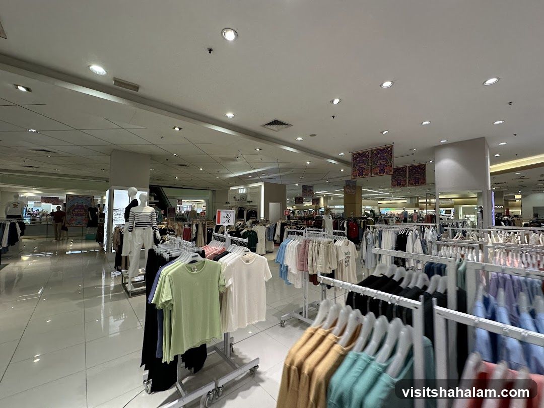 Clothing store interior with racks of apparel