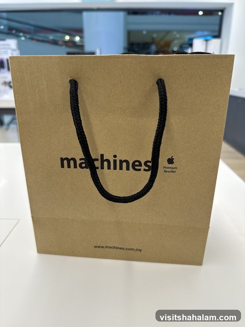 Brown paper shopping bag with "machines" logo
