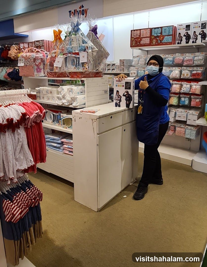 Store employee with baby products