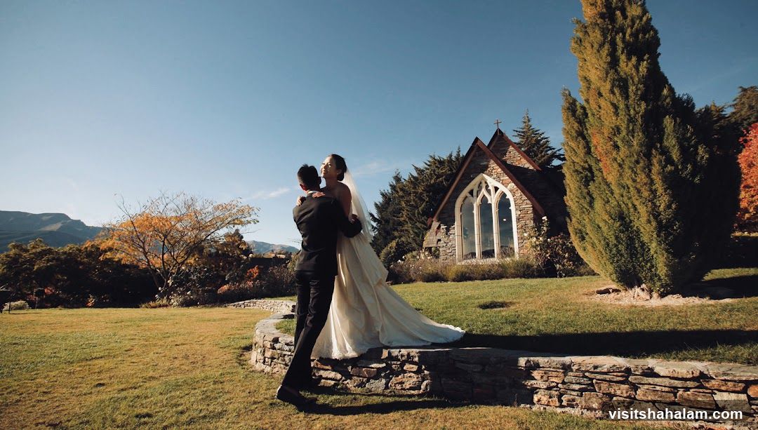 Wedding Couple Embracing Outside Chapel