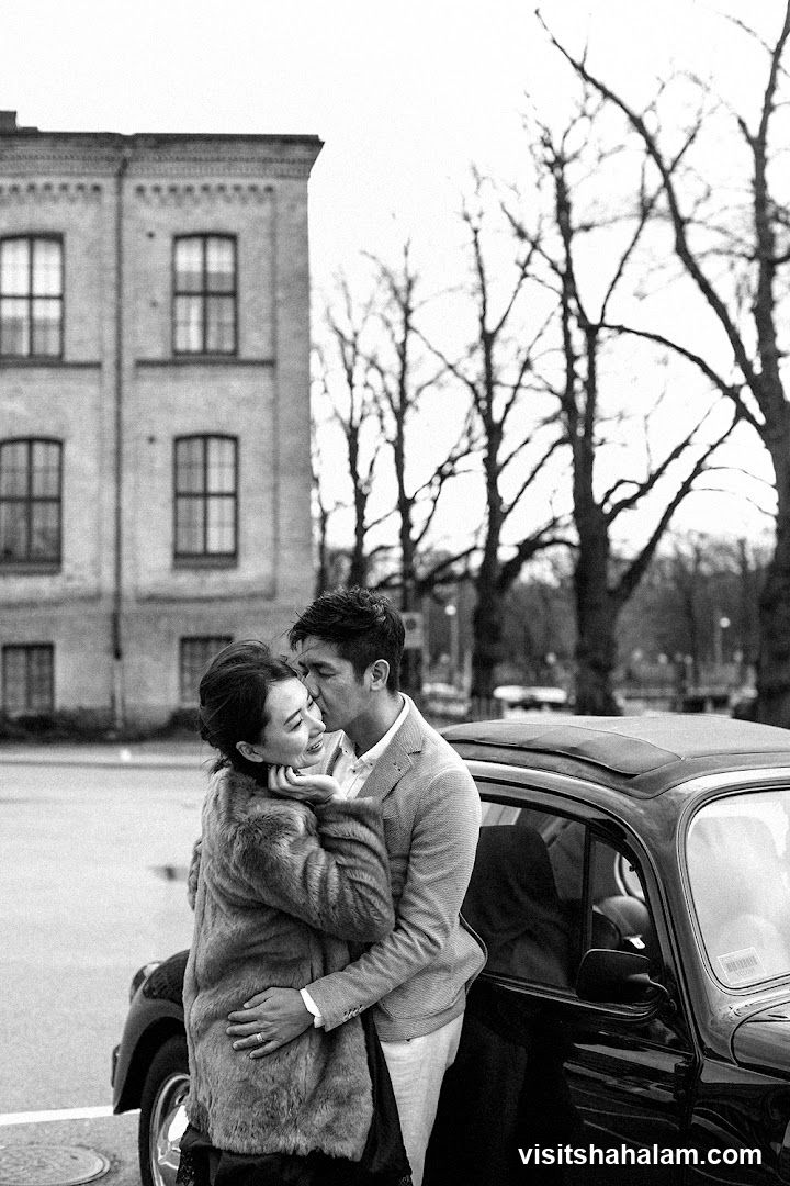 Couple by a vintage car
