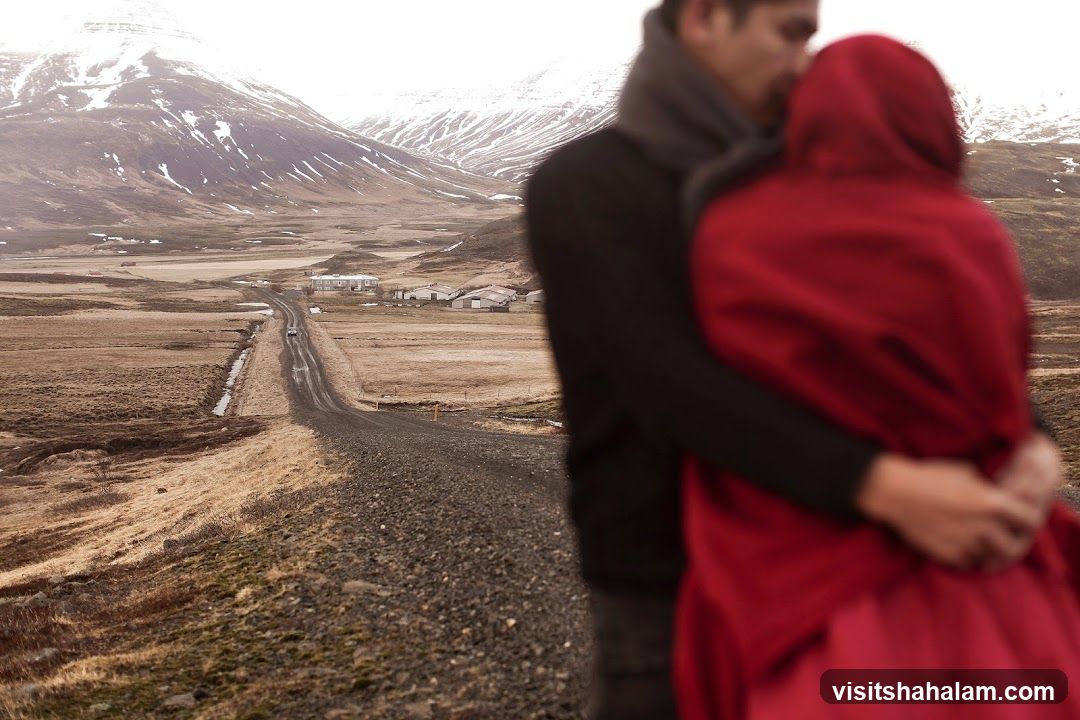 Couple embracing in a rural landscape