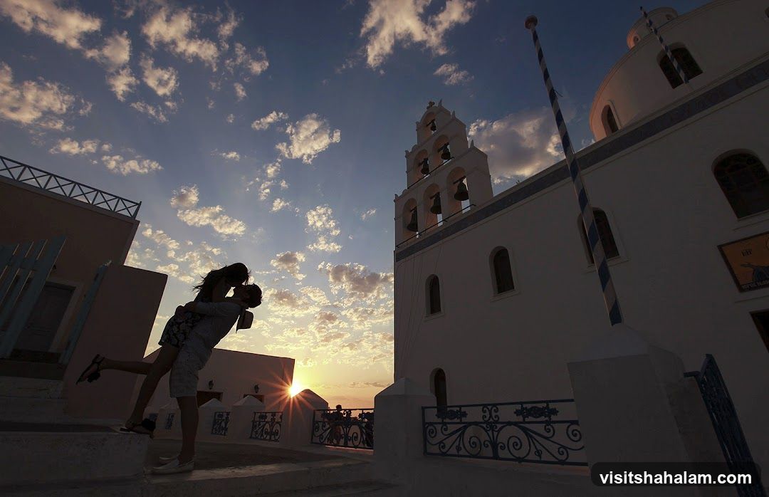 Couple kissing at sunset
