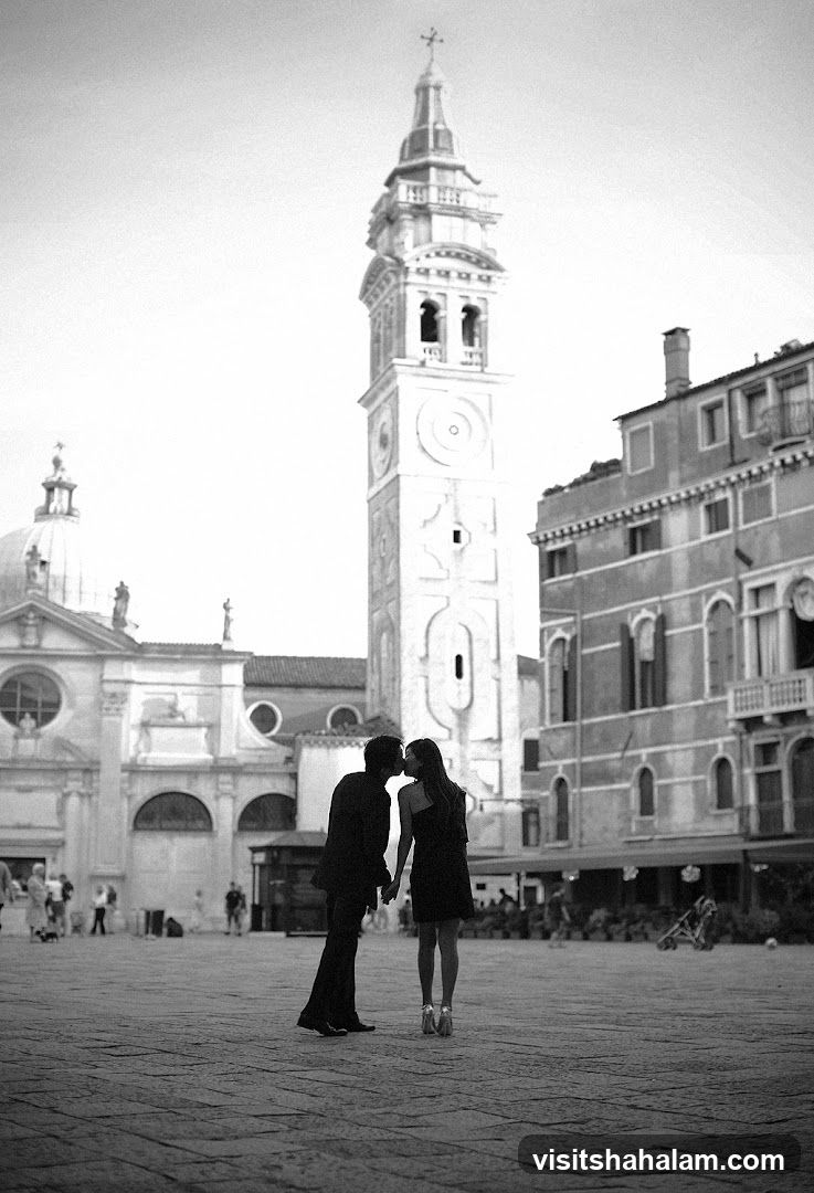 Couple kissing in a square