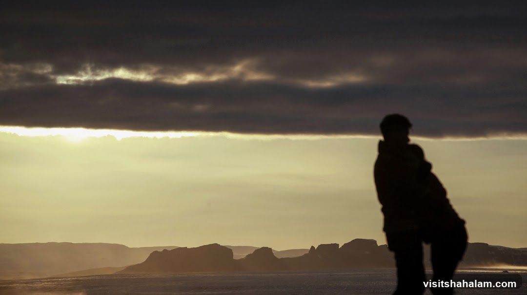 Silhouettes against a dramatic sky