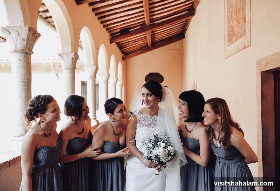 Bride and bridesmaids posing for a photo