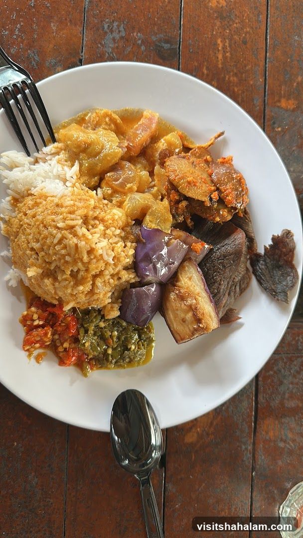 Plate of food with rice and various side dishes