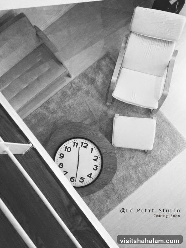 Interior shot with clock and furniture