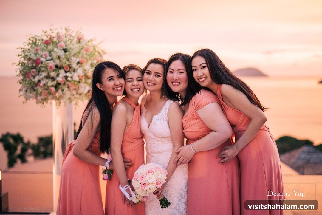 Bride and bridesmaids posing for a photo