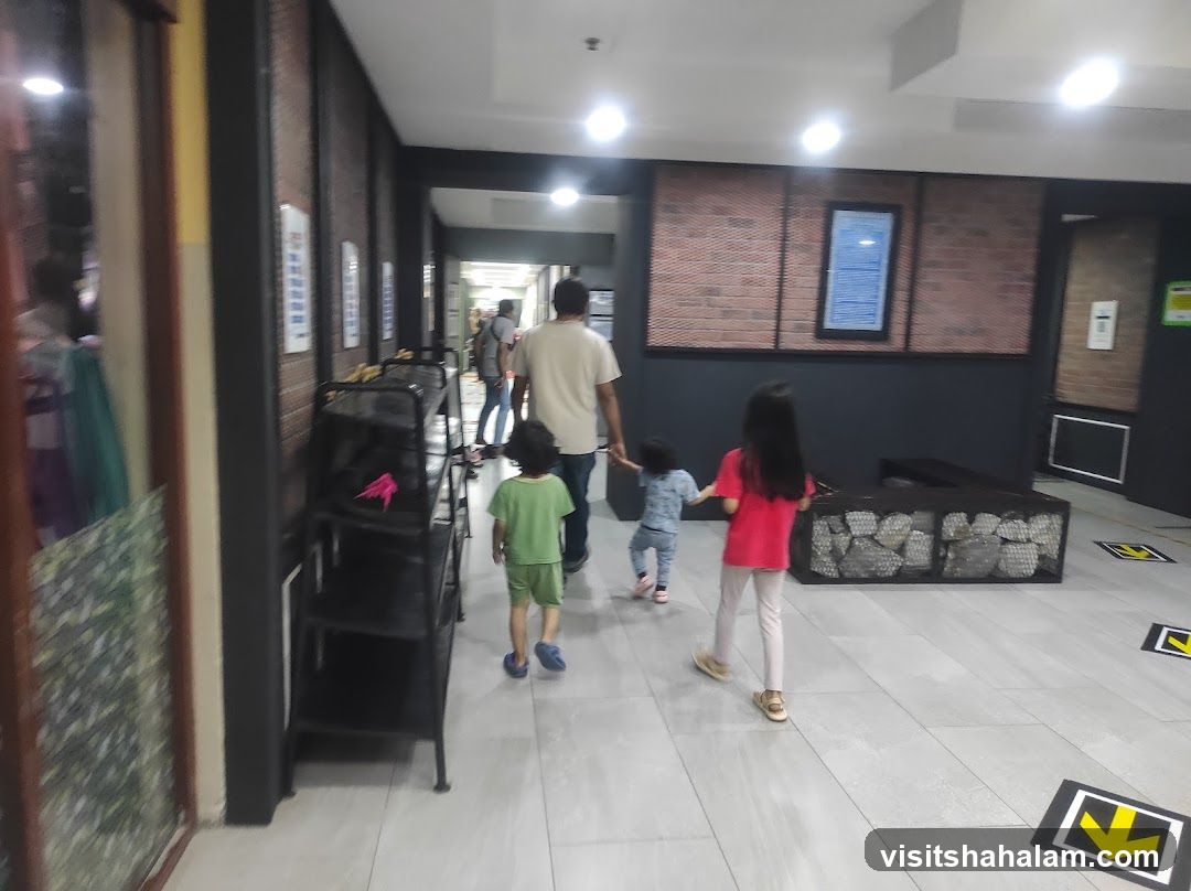 Family walking down a hallway