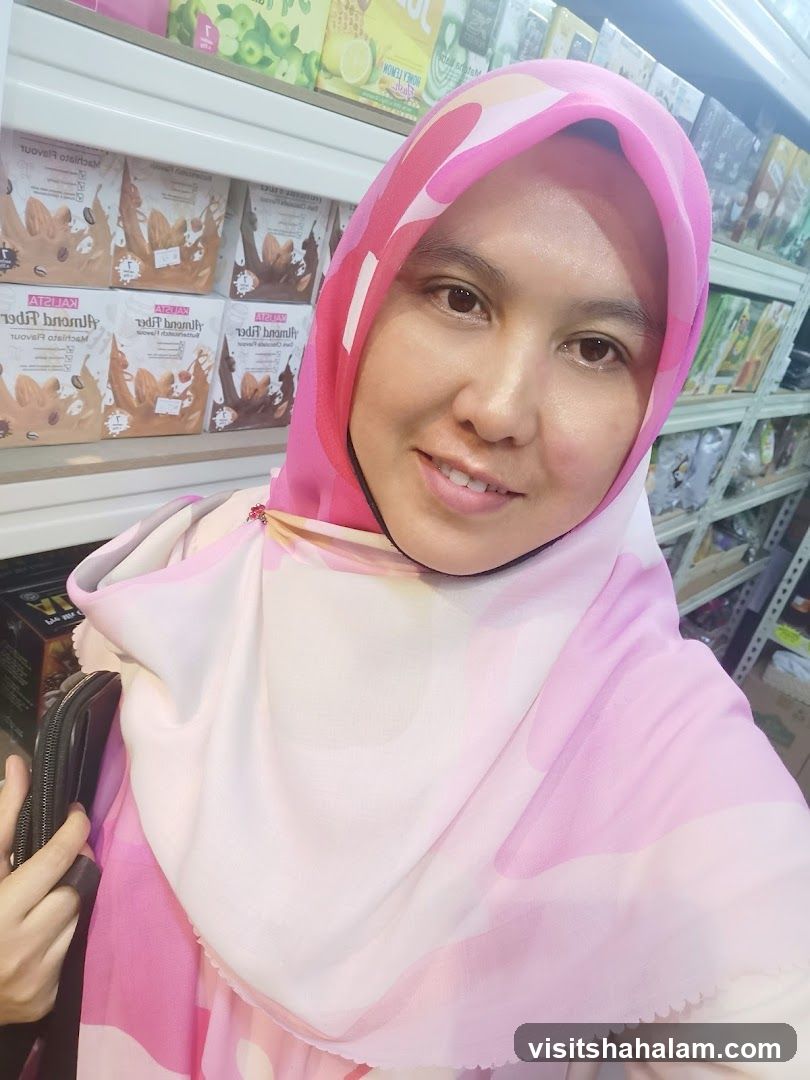 Woman in a pink hijab in a store