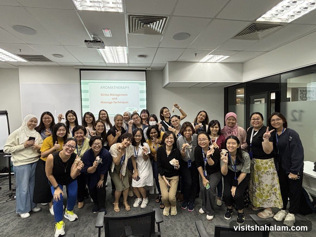 Group Poses for a Photo During an Aromatherapy Workshop