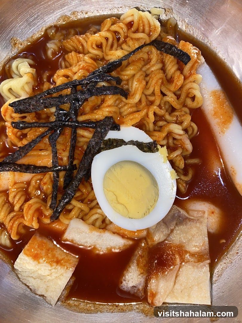Spicy Noodle Dish with Egg and Tofu