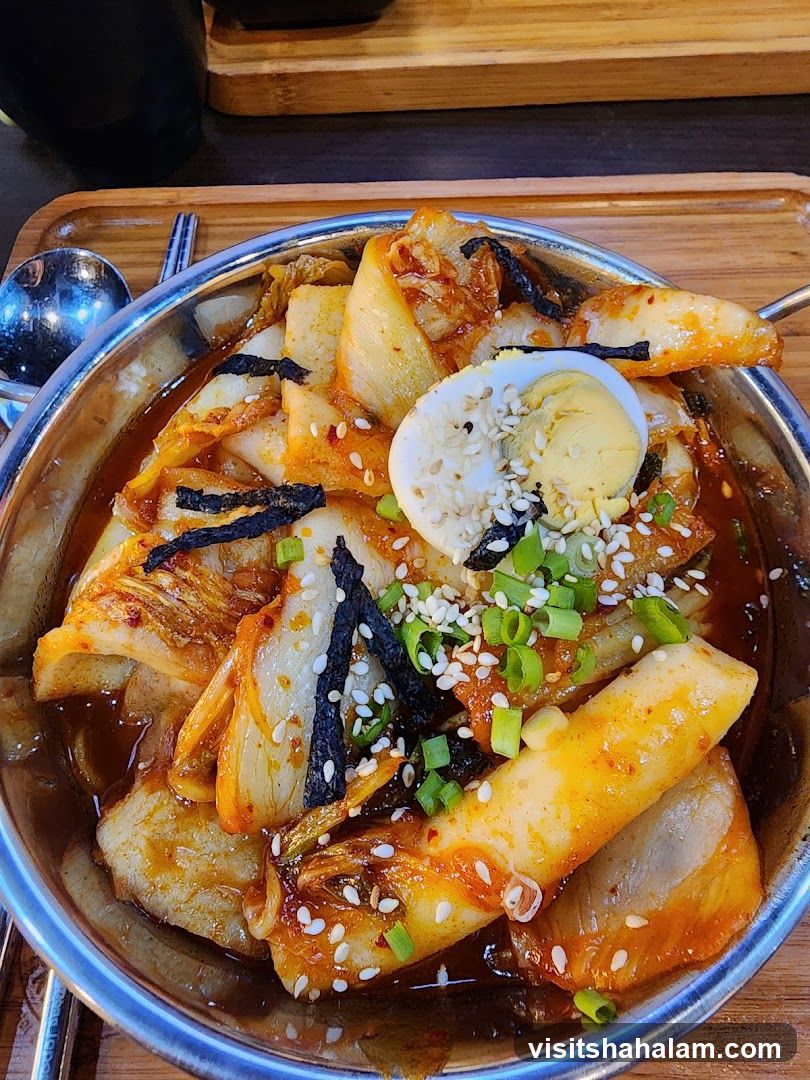 Spicy Kimchi Stew with Rice Cakes and Egg