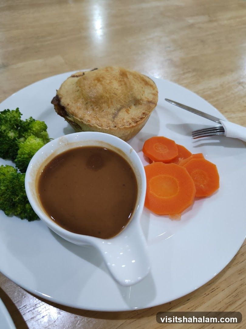 Pie with vegetables and gravy