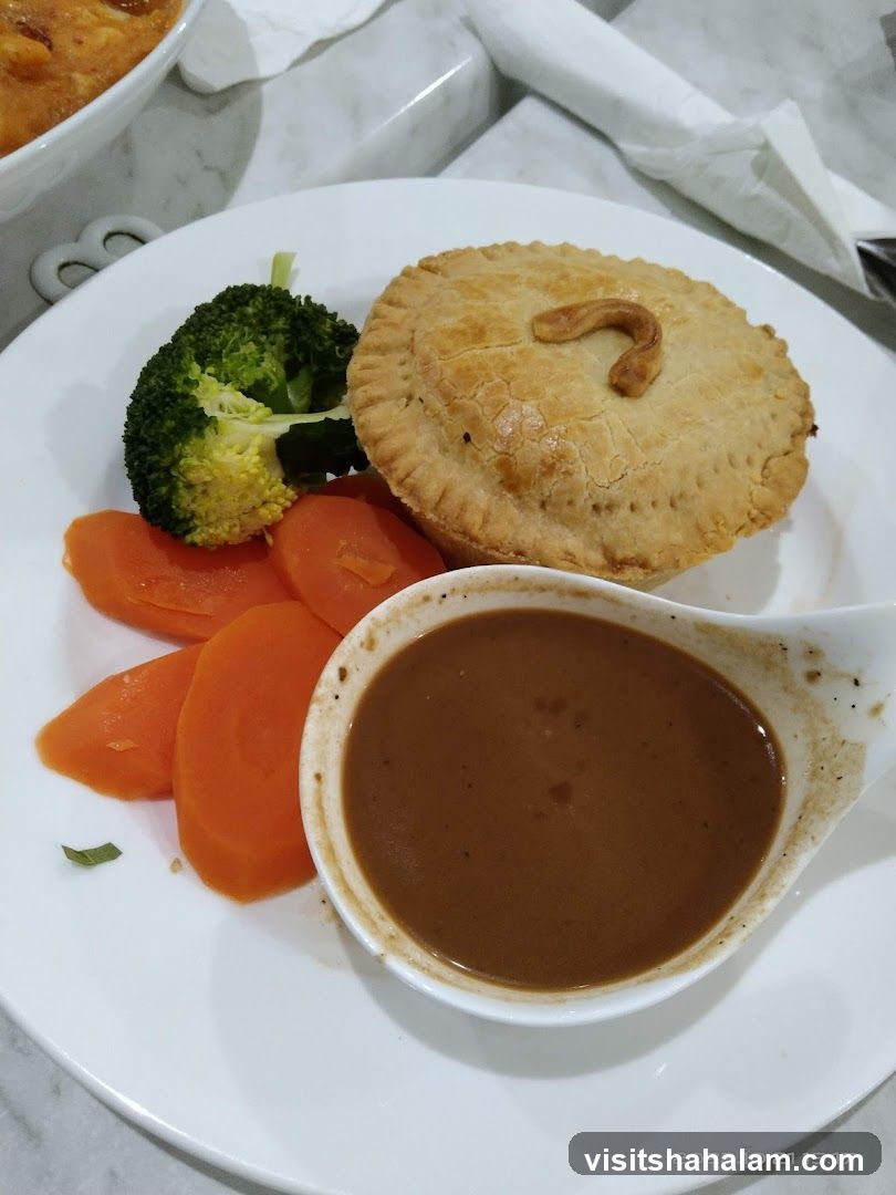 Pie with vegetables and gravy