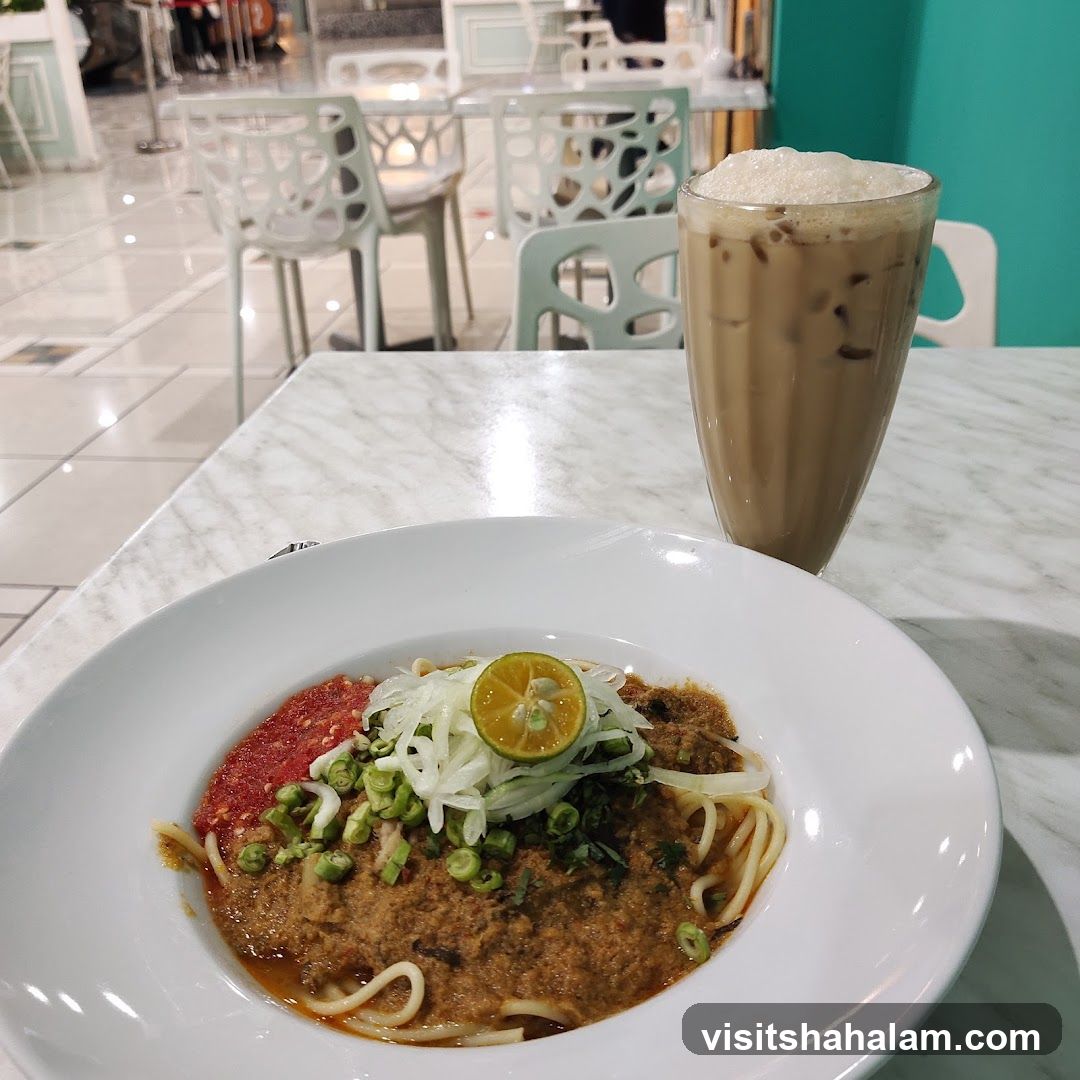 Noodle dish with iced coffee