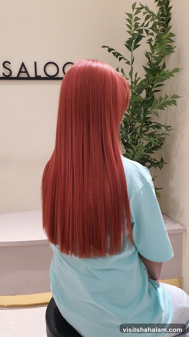 Woman with long, straight, reddish-brown hair