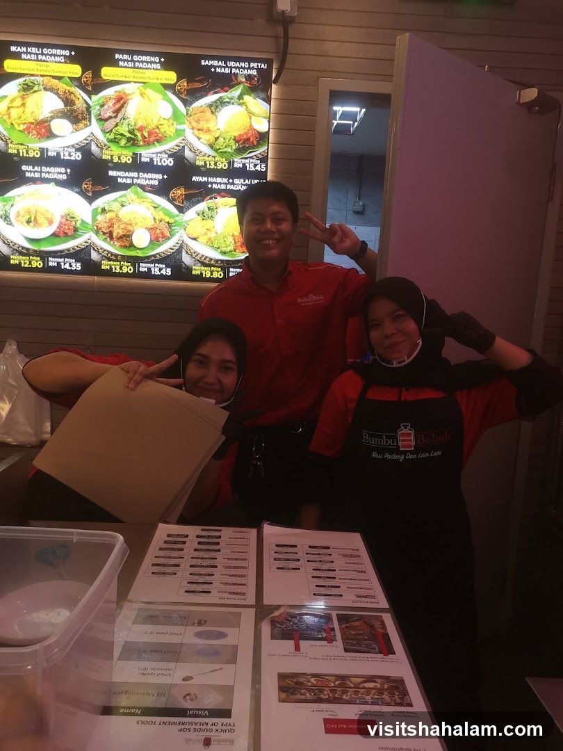 Staff Posing in Front of Menu