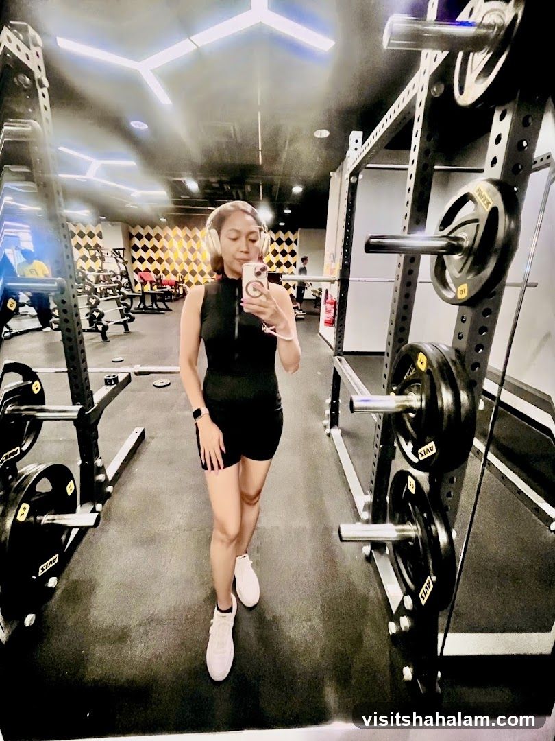 Woman taking a selfie in a gym