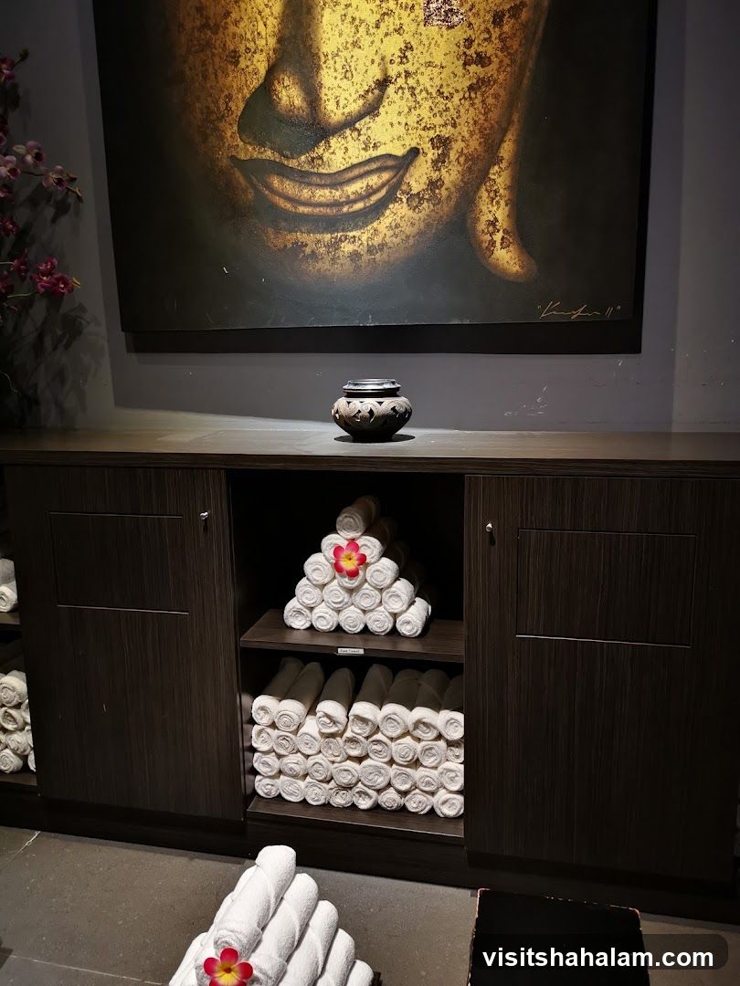 Spa Interior with Buddha Art and Rolled Towels
