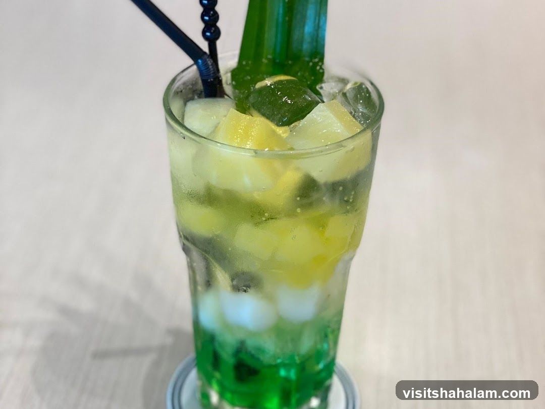 Refreshing Green Drink with Fruit and Ice