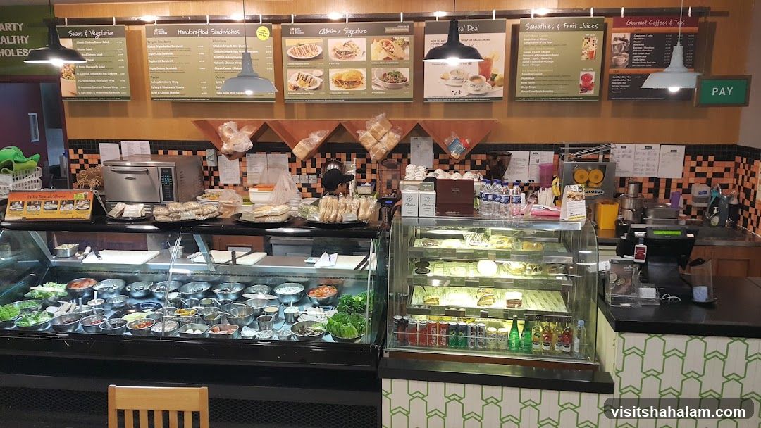 Cafe Interior with Food Display and Menu Boards