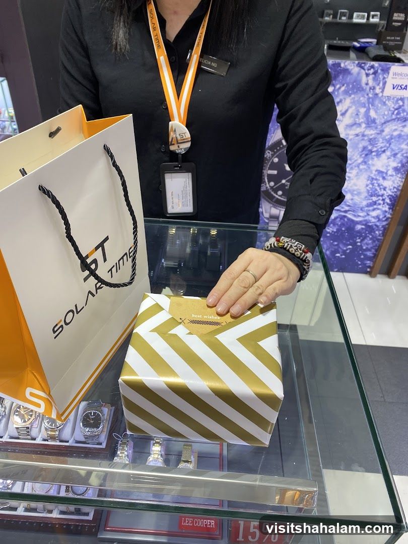 Sales Associate with Gift Wrapped Item