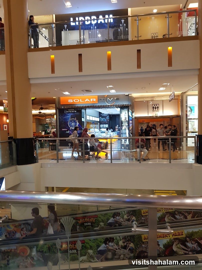 Mall Interior with Shops and Escalators