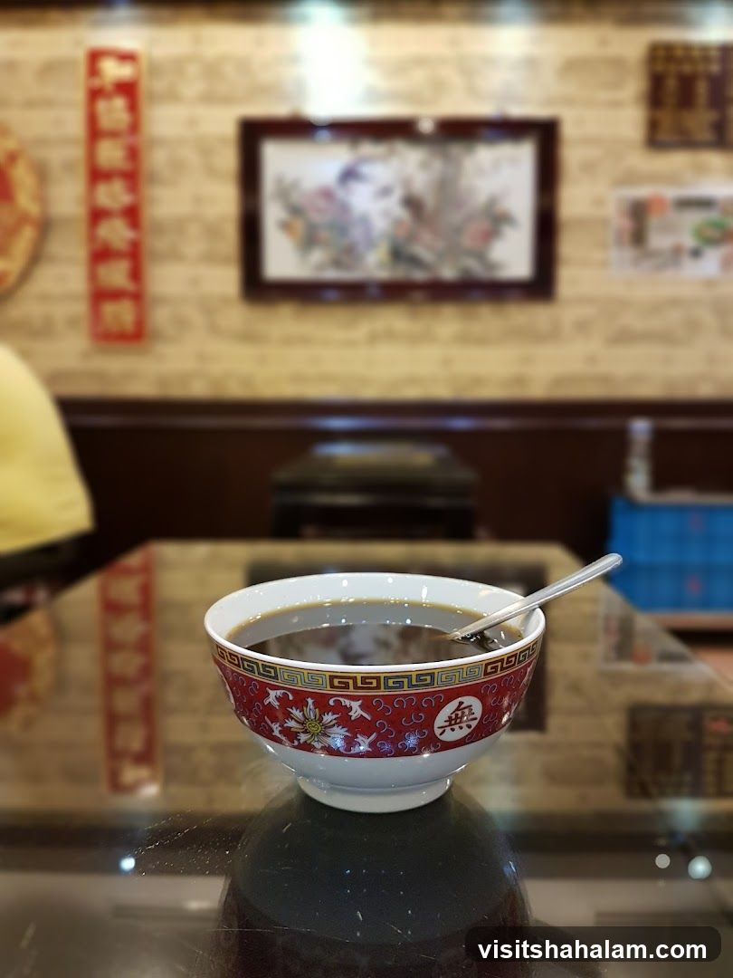 Bowl of dark liquid on a table