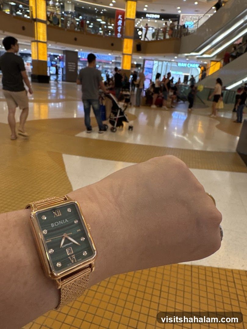 Person wearing a Bonia watch in a mall