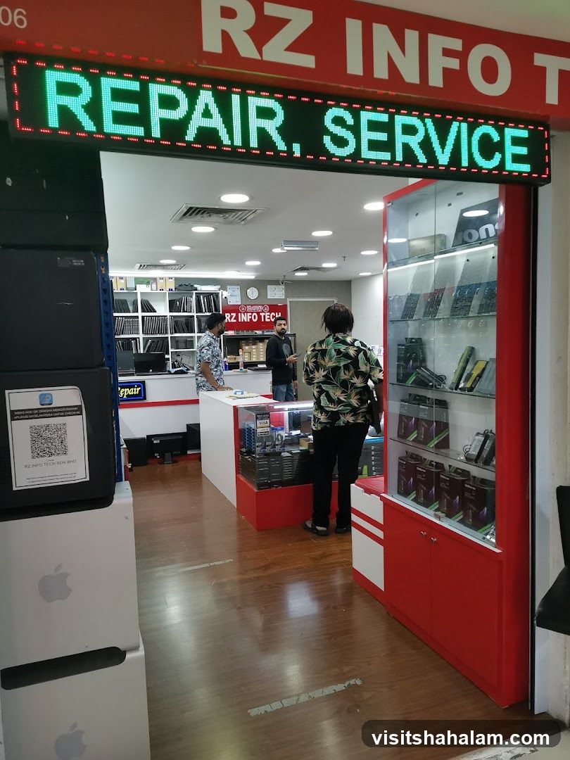 The exterior of a tech repair and service shop. An LED sign above the entrance reads "REPAIR. SERVICE." Inside, shelves are stocked with laptops and electronic accessories. Display cases showcase various tech gadgets.