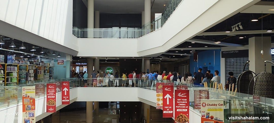 Mall Interior with Shops and People