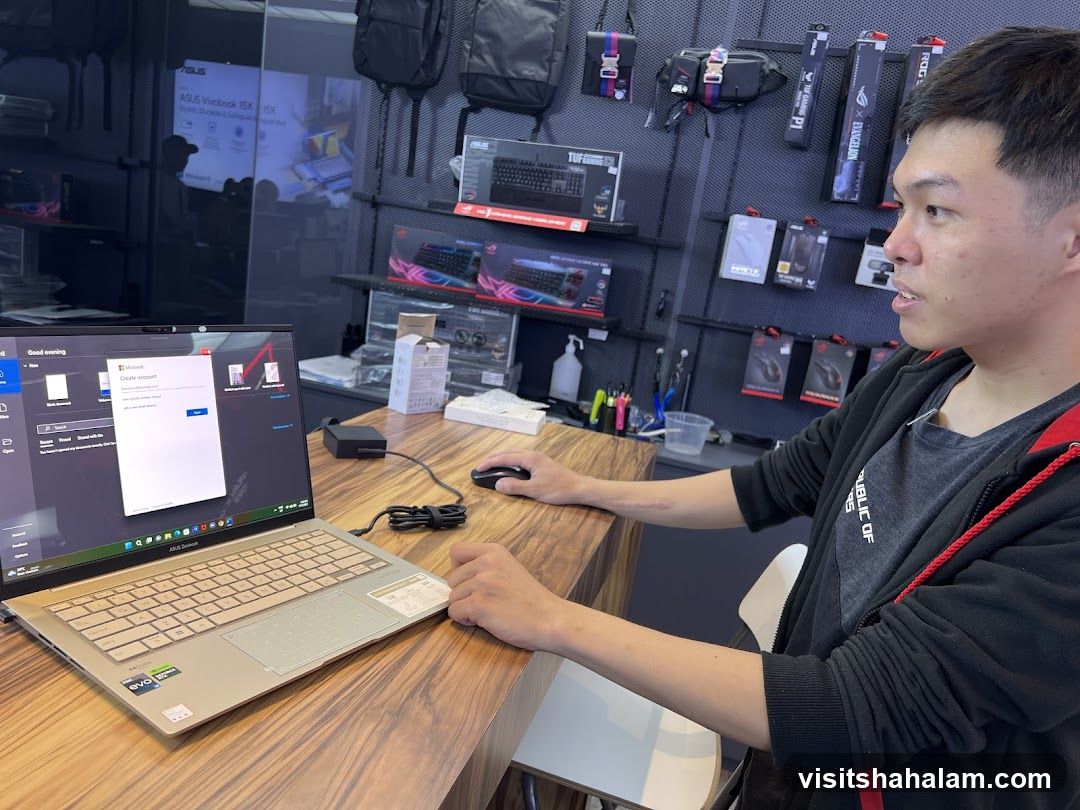 Man using a laptop in a store