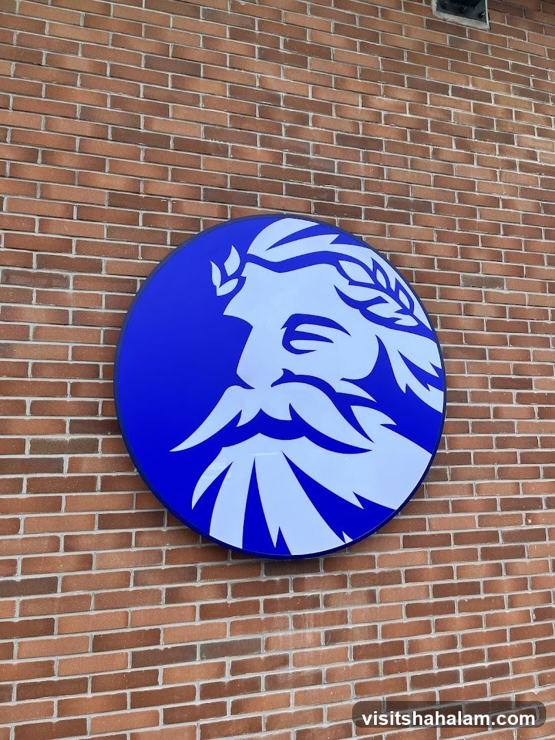 Circular Logo on Brick Wall