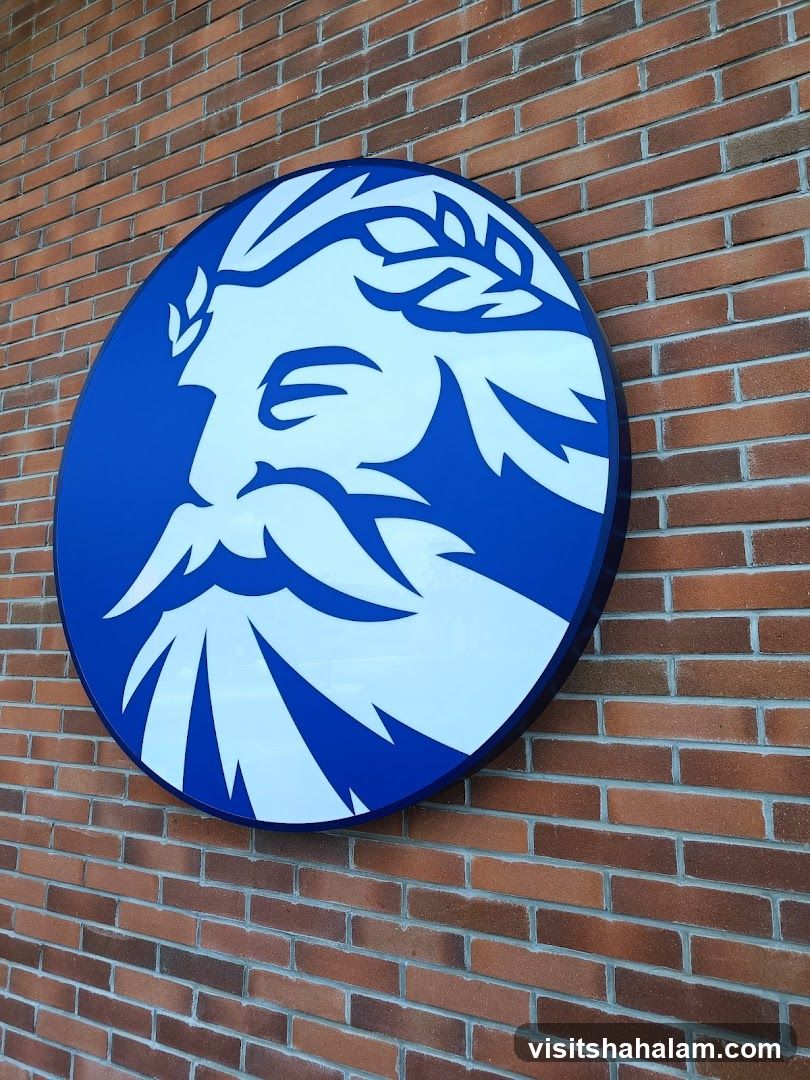 Circular Logo on Brick Wall