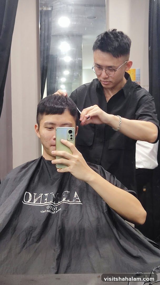 Barber cutting client's hair