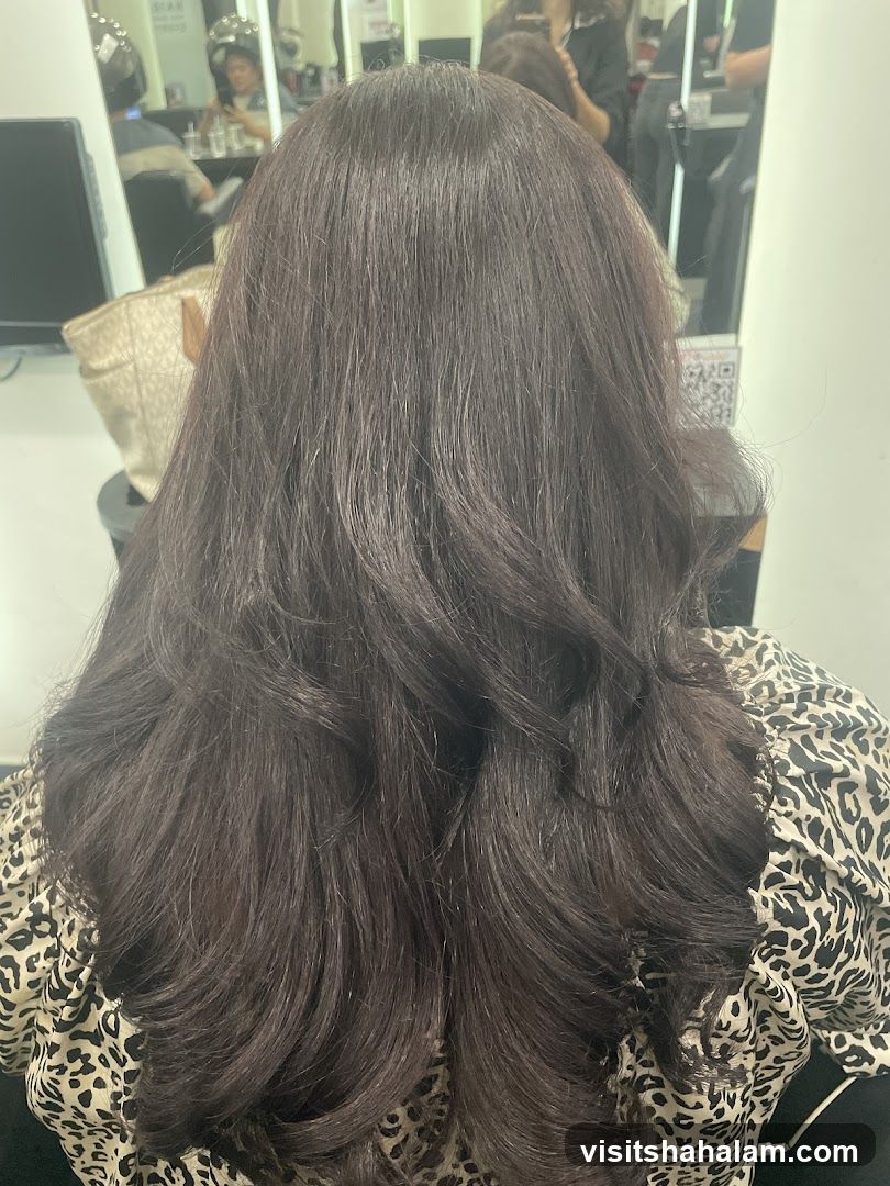 Woman with dark, wavy hair