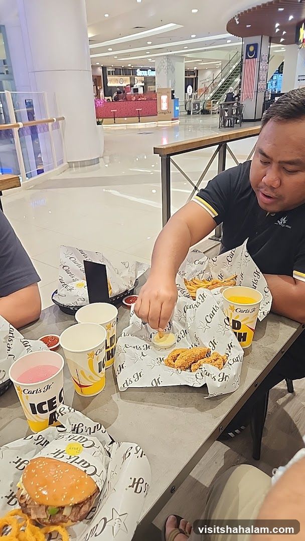 People eating at Carl's Jr.