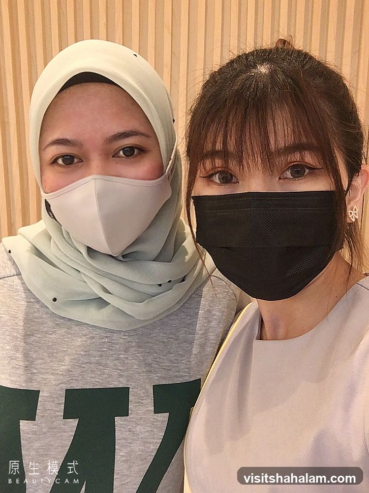 Two women wearing masks