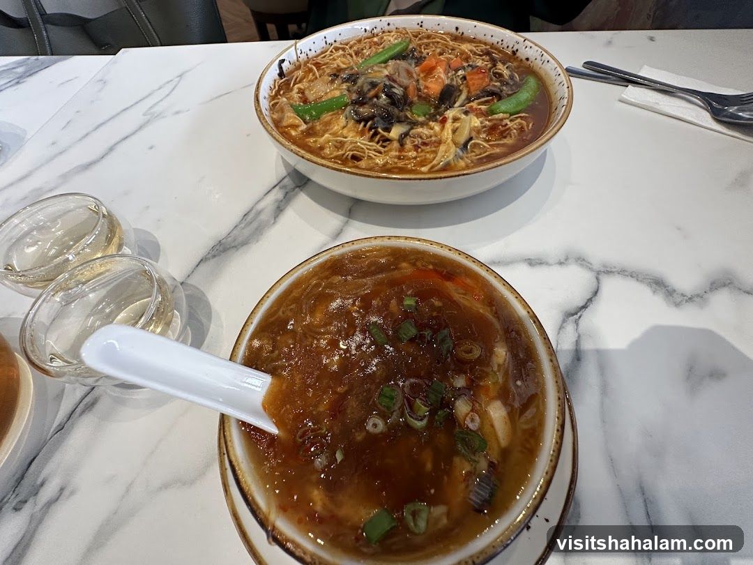 Two Bowls of Soup on a Marble Table
