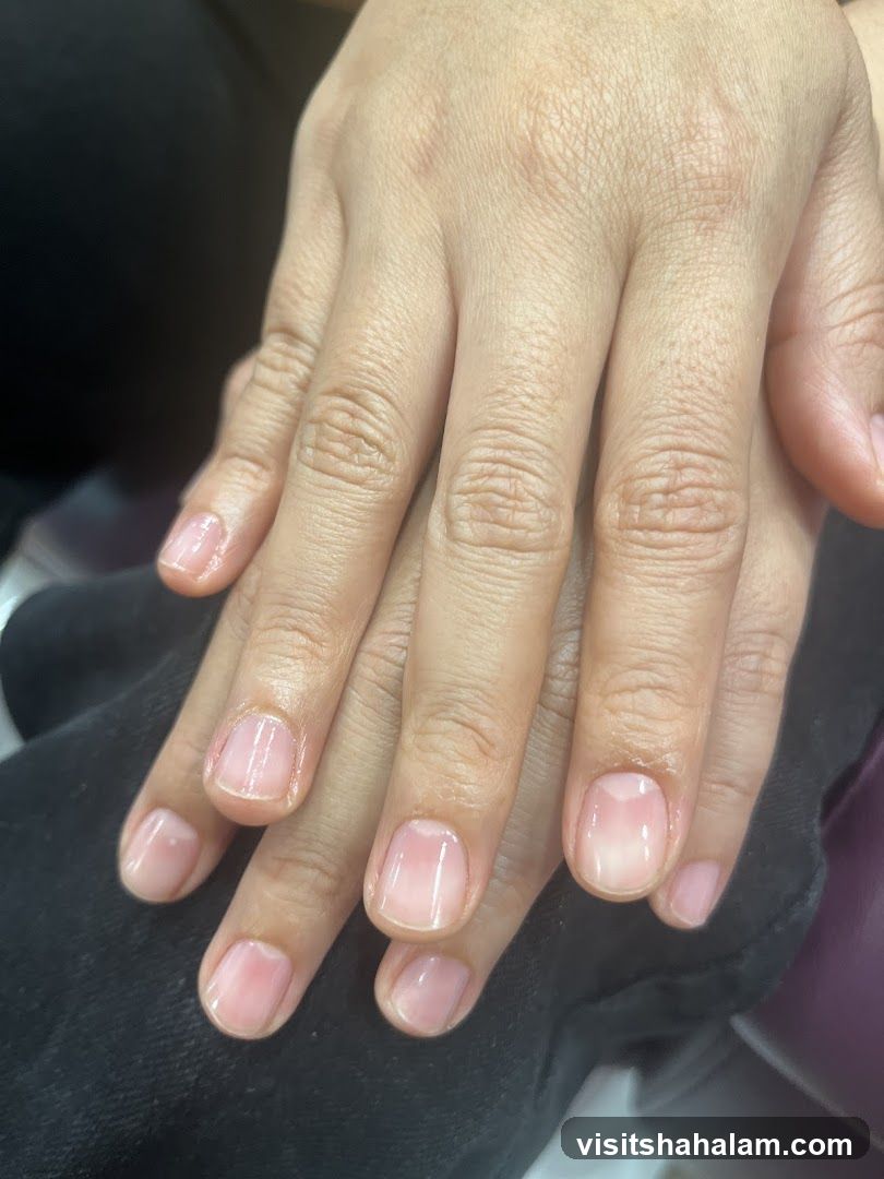 Hands with a Sheer Pink Nail Polish