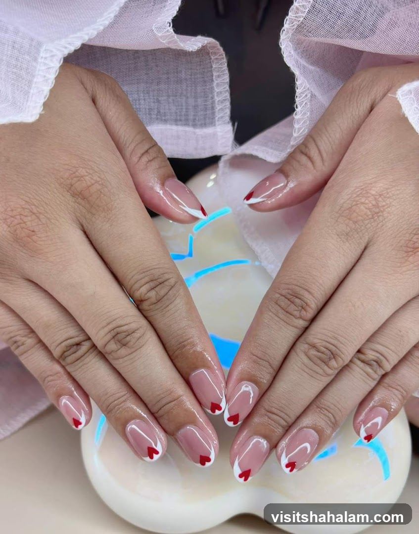 French Manicure with Red Hearts