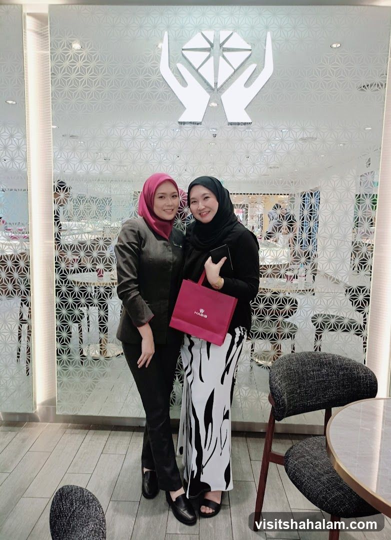 Two women posing in front of a store