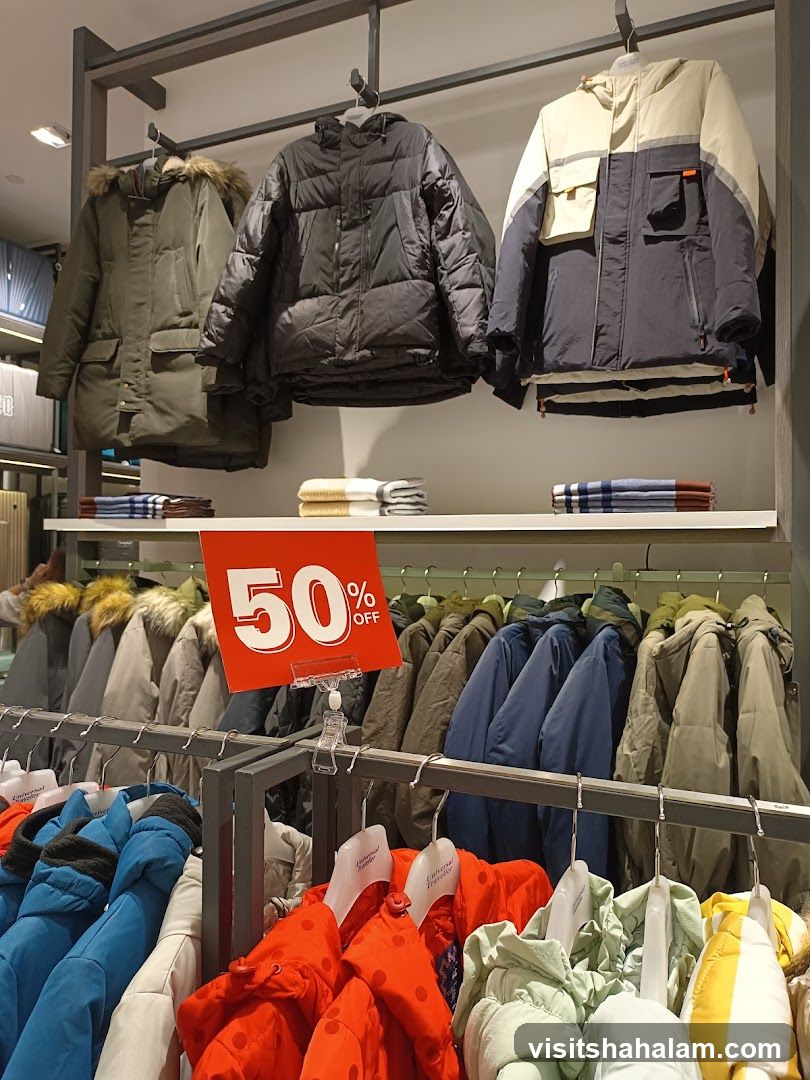 Winter Coats on Display with 50% Off Sale Sign