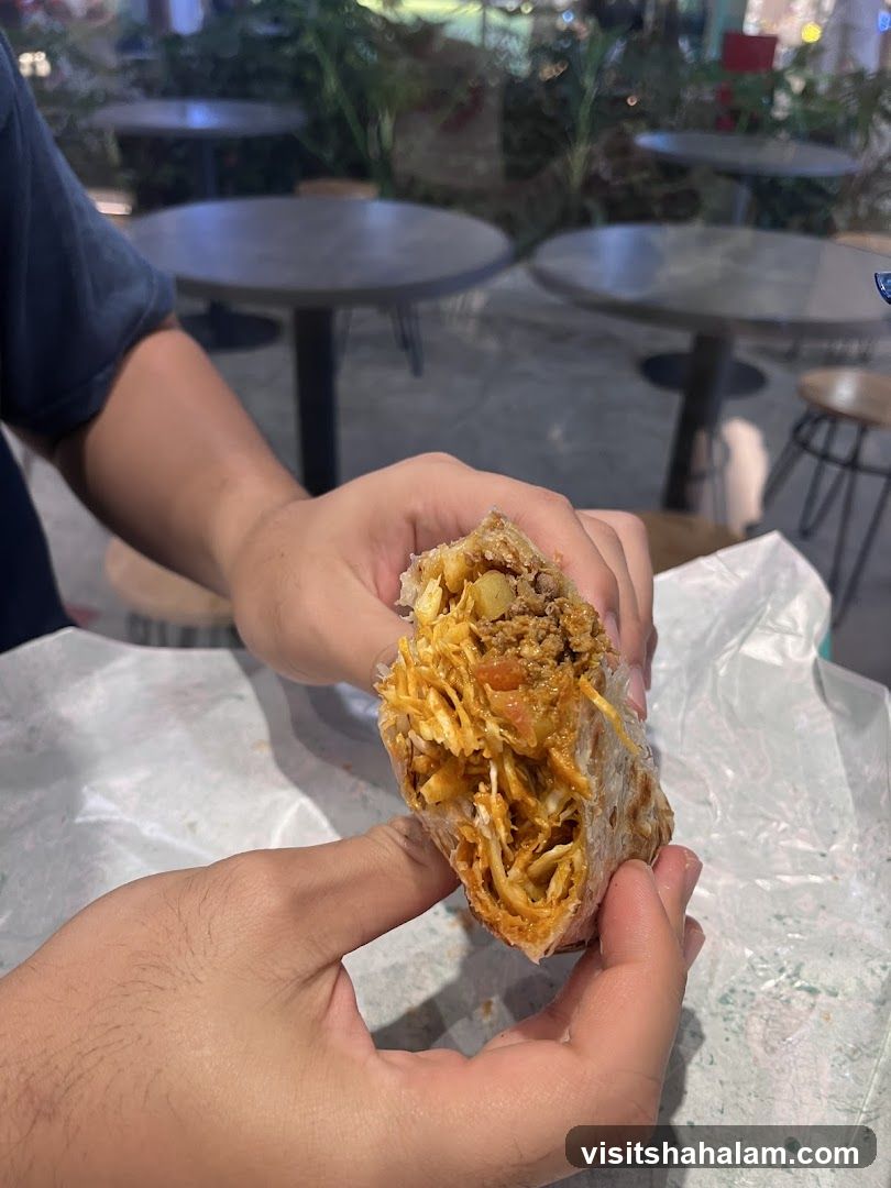 Person holding a burrito